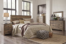 Trinell Brown Panel Bedroom Set