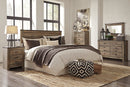 Trinell Brown Panel Bedroom Set