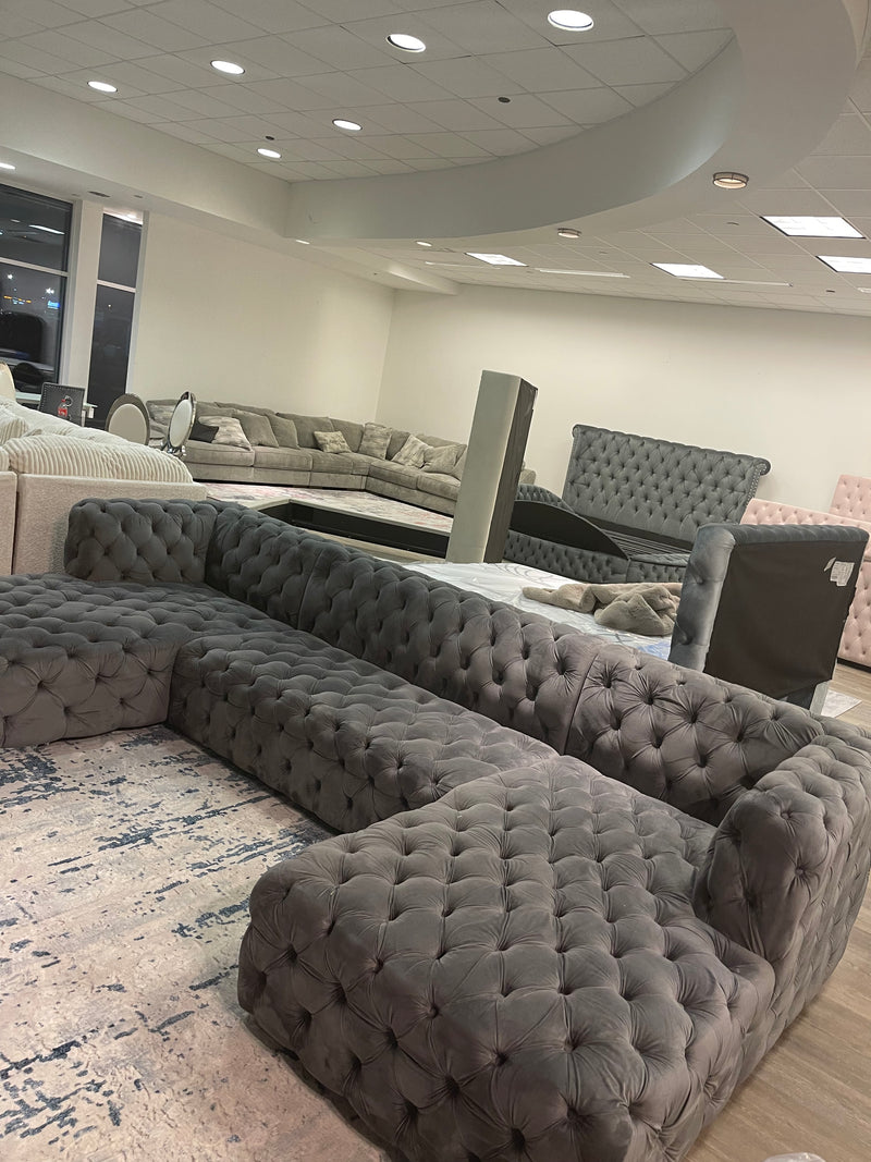 U shaped Sectional fully tufted ( Floor Model)